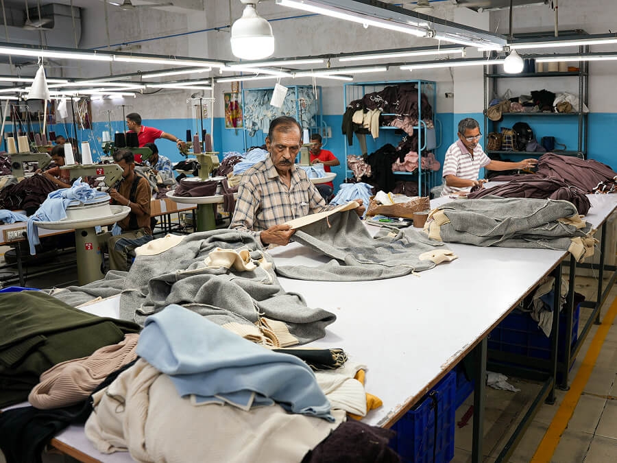 QC table — measuring and inspecting finished garments